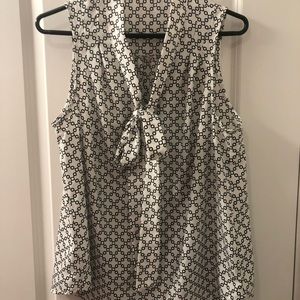 Black and white sleeveless tie front blouse